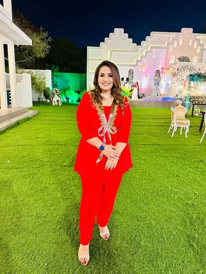 A bright red co-ord set for my beautiful girls. The peplum-style top with the embellished bow and matching pants is a fun and festive choice.