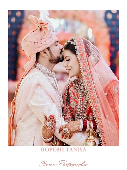 An intimate and tender moment as the groom kisses the bride's forehead. A classic shot that is always timeless.