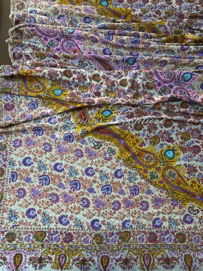 The dupatta is laid out to display its generous length and the grandeur of its all-over pattern, making it a true heirloom piece.