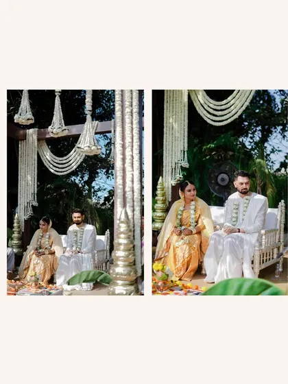 A serene shot of the couple seated at their mandap. The minimalist decor with white floral strings creates a peaceful and elegant atmosphere for their vows.