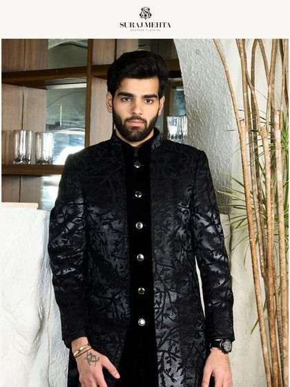 This black kurta with a subtle leaf-like pattern and velvet placket is perfect for an evening of celebration, offering a look of refined luxury.