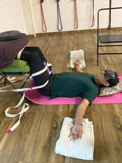 Another variation of a Sunday relaxing session. The setup with the chair, bolsters, and weights helps to release the psoas muscle and calm the nervous system.