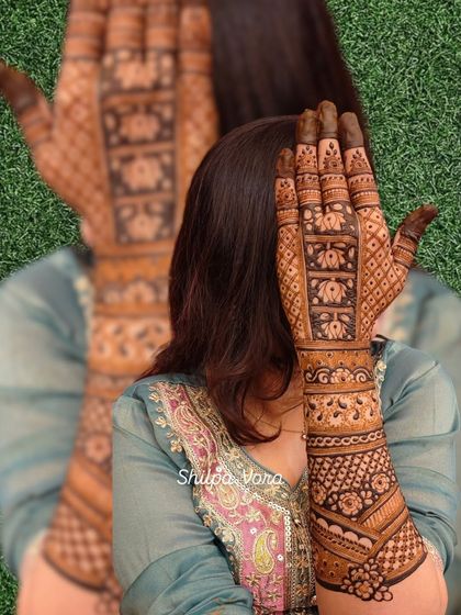 A full-arm design with repeating lotus block patterns, creating a stunning and elongated look.