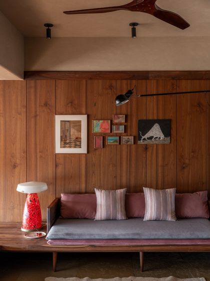 The material palette was chosen to be a canvas for the clients' stories. Natural and timeless materials like teak wood and yellow Kota stone create a minimalist yet layered aesthetic that feels personal.