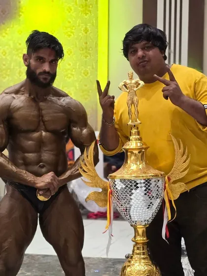 One title trophy. Standing proud with my champion and his massive trophy. This is the symbol of our victory.