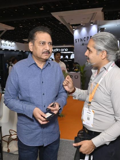 An exhibitor explains the nuances of their smart home product to an engaged visitor. These direct interactions are crucial for communicating value and building trust.
