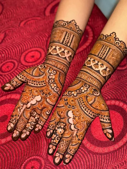 The same engagement design against a vibrant red background, making the henna color pop.