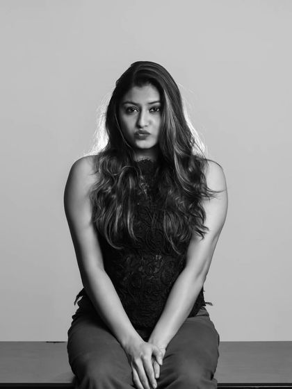 This black and white shot captures a more serious and contemplative expression, showing the versatility of a single studio session.