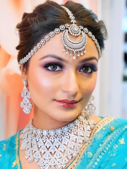 This direct look into the camera shows the intensity of the eye makeup and the flawless base. Mastering skin is the first step to any great makeup look.