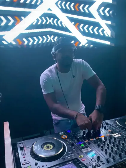 Another angle of me working the decks, showing my concentration and professional gear.