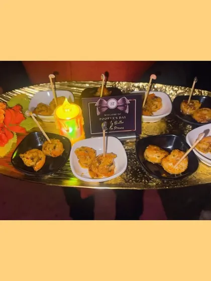 A platter of our delectable appetizers, including Garlic Butter Prawns, ready to be served. Each dish is crafted with care and elegance to make your celebration unforgettable.