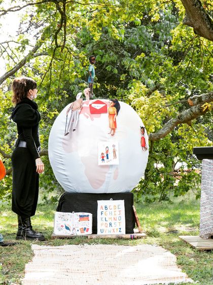 A closer look at the unique stage design for 'Pajarillo Verde', featuring an inflatable globe decorated with illustrations. The scenography is an integral part of our storytelling.