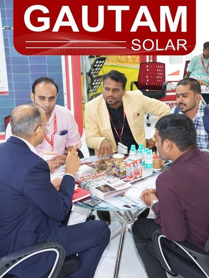 A business meeting in progress at our booth during the REI Expo 2024. These collaborations are key to driving the solar industry forward.