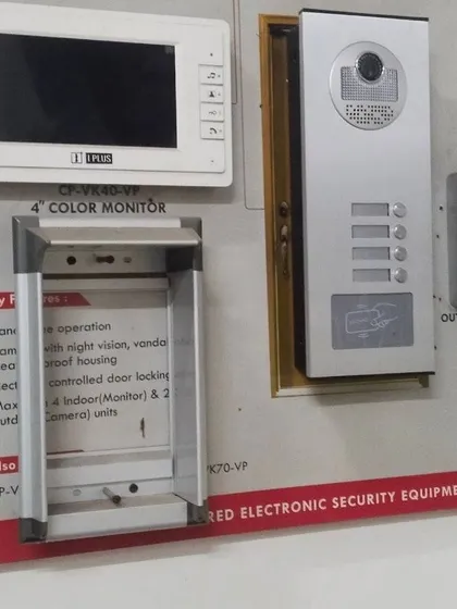 This display shows some of the different video door phone models and outdoor units I work with. You can see options for single-button bells and multi-button panels for buildings with several flats.
