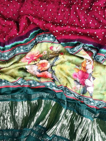 A beautiful Bandhej digital printed dupatta with a mix of floral and geometric patterns in rich green and maroon. This 2.75-meter piece can be styled in multiple ways.