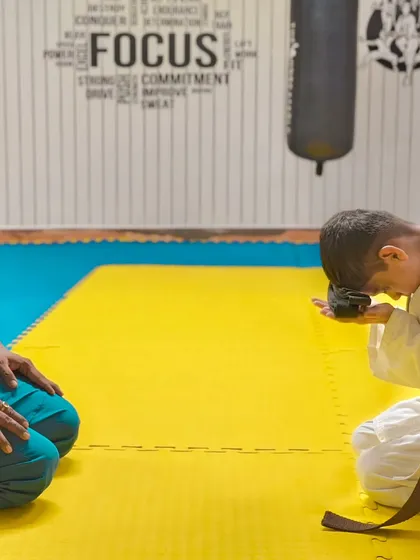 The journey in karate is marked by respect and milestones. Here, I am awarding a new belt to a dedicated student, a tradition that honors their hard work and progress in our dojo.