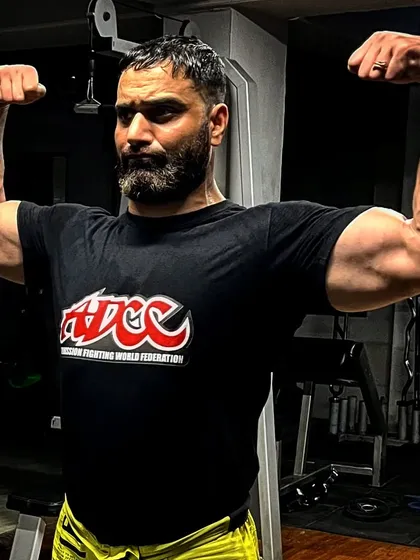 As a grappling competitor myself, I understand what it takes. This is the physique built for combat sports, wearing the gear of the prestigious ADCC grappling federation.