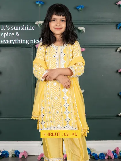 It's sunshine, spice, and everything nice. This yellow kurta set with mirror work and a light dupatta is a cheerful and elegant choice for any celebration.
