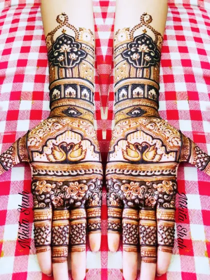 Symmetrical swan designs for a bride's sister. This is a perfect example of a full, festive look suitable for close family members.