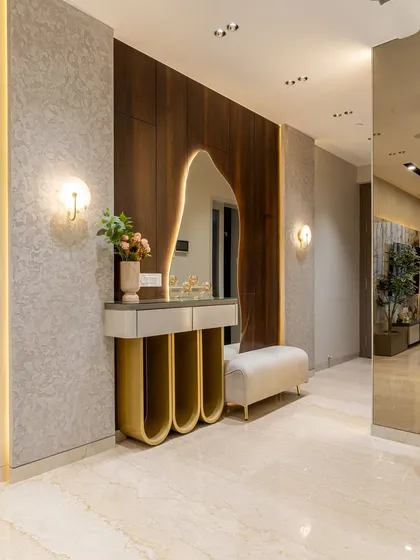This corner is a statement of quiet luxury. From the sculptural mirror to the golden curves of the console, every detail speaks of our design philosophy. Marble floors, mood lighting, and touches of green breathe life into this modern masterpiece.