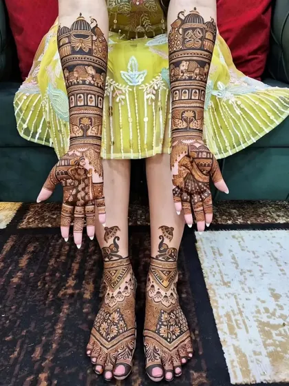 A complete bridal look is essential, which is why I coordinate the designs for both hands and feet. This set features matching traditional Rajasthani patterns with elephants and intricate details that flow from the arms down to the toes.