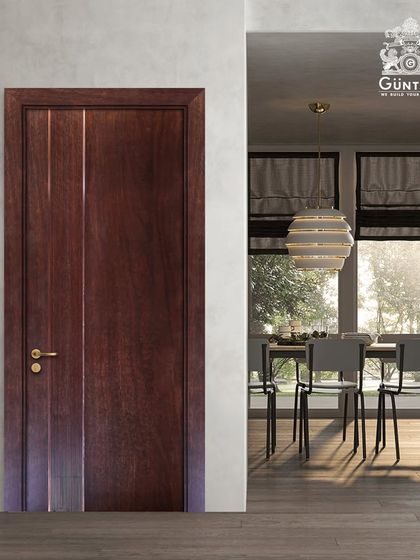 A modern veneer door with clean lines and subtle metal inlays. This design is perfect for a sophisticated dining room entrance, blending seamlessly with contemporary decor.