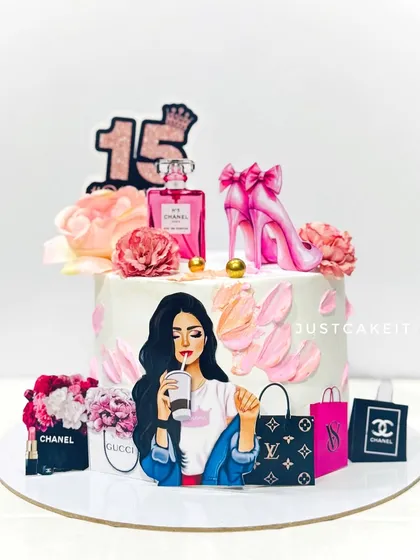 A chic and fashionable cake for a 15th birthday. The design includes edible images of designer brands and a stylish girl, perfect for a teenager.