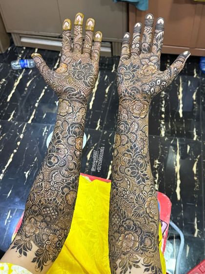 Another view of this beautiful bridal design, showing the full coverage from fingertips to elbows.