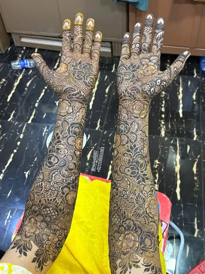 Another view of this beautiful bridal design, showing the full coverage from fingertips to elbows.
