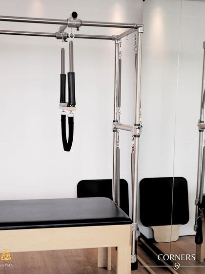 A corner of the studio featuring the Cadillac. This impressive apparatus is a complete workout system in itself, offering endless possibilities for movement.
