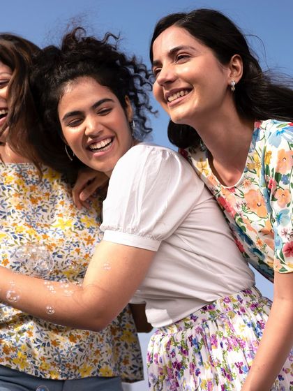 A candid, happy moment from a Fable Street shoot. This kind of image is perfect for social media content, showing the clothes in a relatable, joyful context that connects with customers.