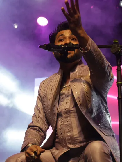Reaching out to the audience during a song. It's all about that connection.