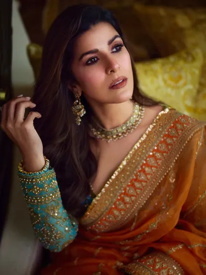 A close-up of Nimrat Kaur's look, showing the soft brown eye makeup and flawless skin that looks incredible on camera.