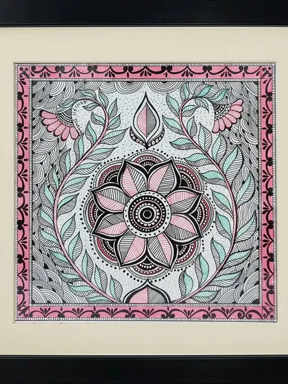 A floral mandala is the focus of this intricate Madhubani painting by Lakshit Mukhiya. The symmetrical design and use of pink, black, and mint green create a soothing and decorative effect.