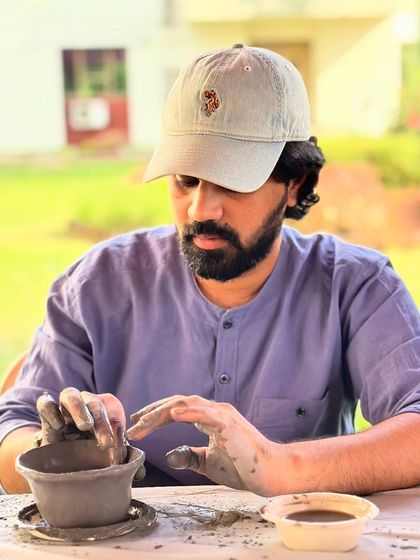 A moment of quiet focus during our corporate pottery session. Hand-building with clay encourages a state of flow, offering a much-needed break from daily deadlines.