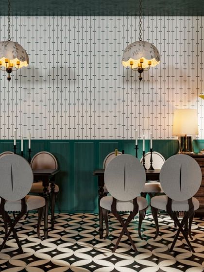 A dining room that uses our tiles to great effect. The floor features a bold geometric pattern, while the wall has a more subtle linear design, creating a layered and sophisticated interior.