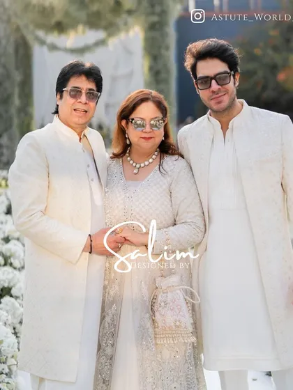 A family looking elegant in coordinated white and ivory outfits that I designed for a wedding event. Creating a cohesive look for a family is a service I truly enjoy.