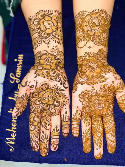 Another look at a classic floral design, showing the intricate details on the fingers and wrists.