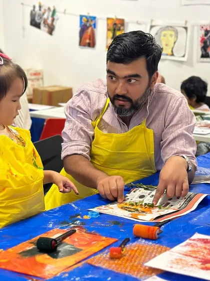 Another view of a father and daughter collaborating on their artwork. The concentration and teamwork on display are exactly what I hope to inspire.