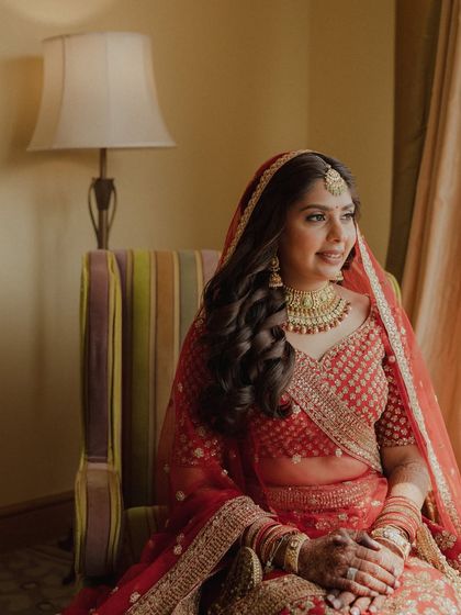 Posed by the window, the natural light beautifully illuminates her features and the soft glam makeup.