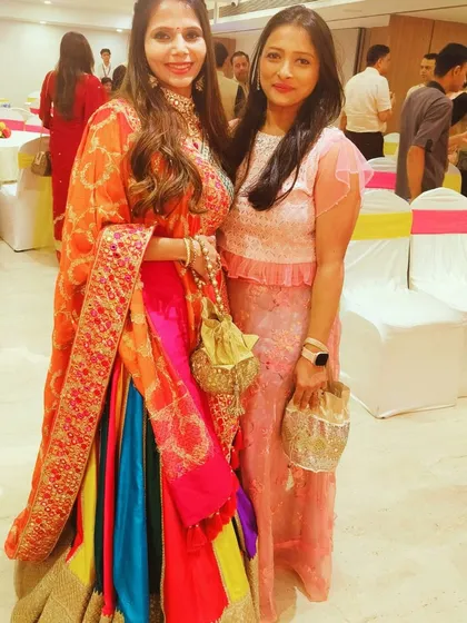 With the radiant client, Shweta, at her Ganesh Pooja and Mehndi function. Her vibrant, multi-colored lehenga perfectly matched the festive and colorful decor I planned for the event.