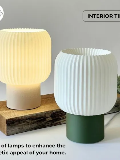 These modern, ribbed table lamps come in different colors to match any decor. Their simple yet elegant design makes them suitable for adding a touch of style and soft light to reception desks or retail display counters.