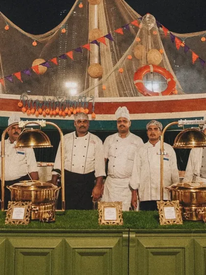 Our team of chefs at the 'Fish Shop' counter, ready to serve. The boat-themed decor adds a fun and thematic touch to the station.