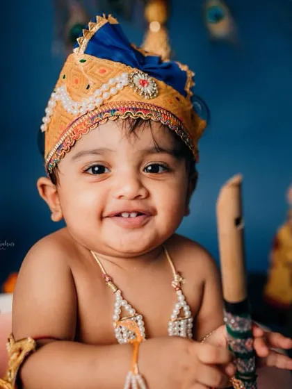 That divine smile can steal anyone's heart. Our little Krishna is posing with his flute for this Janmashtami photoshoot.