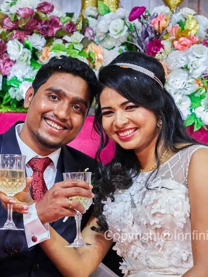 Cheers to the happy couple. This is a fun, classic reception shot that captures the celebratory mood of the evening.