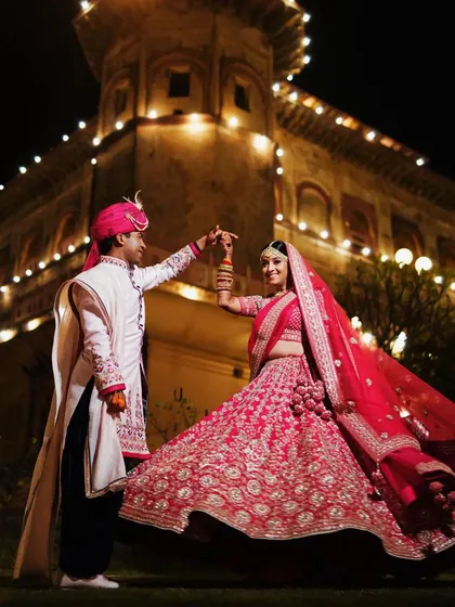 A magical dance at a destination wedding in Rajasthan. We capture the grandeur of your celebration, ensuring every shot feels epic and full of life.