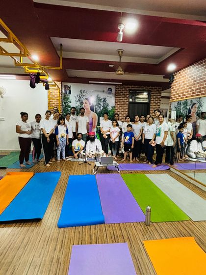 The full group from our International Yoga Day event. It's amazing to see so many people, including children, come together to celebrate yoga.