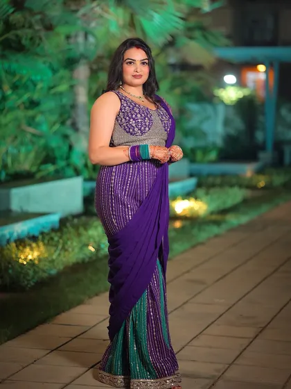 An outdoor evening portrait where the green background lighting adds a touch of magic to the scene.