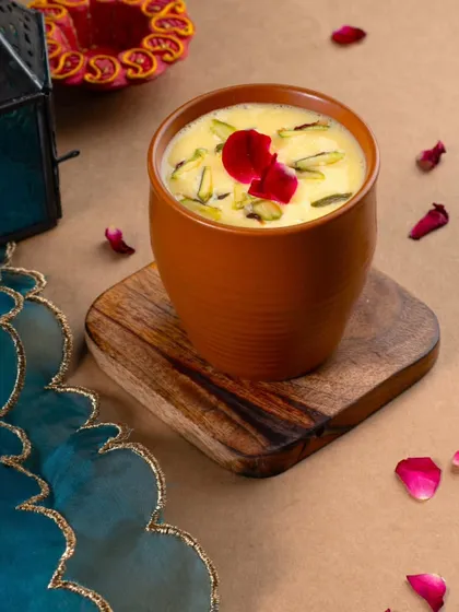 A beautiful serving of our Kesar Pista Thandai, a traditional and refreshing drink perfect for festivals like Maha Shivratri.