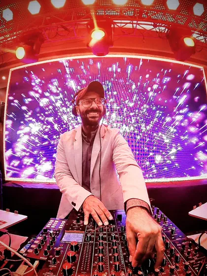 The mix master in action. A great shot of me focused on the music, with a fantastic LED backdrop lighting up the party.